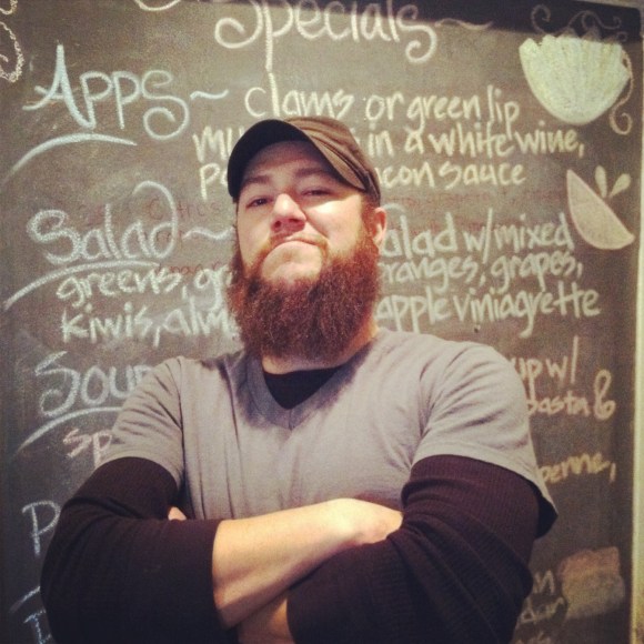 You know you're going to have an awesome pie eating experience if this beard has anything to do with it. We had the pleasure of meeting Brian at Kaos Pizza last weekend. He's been growing this burly beard for the past 2 1/2 years. When we asked what his bearded beauty secrets were, he immediately took out a comb from his back pocket and showed us his dread prevention. He also only uses Aveda products on his locks. He enjoys the different colors that his beard displays---and he also likes that people often mistake him for Fidel Castro. Liberty for beards or death!