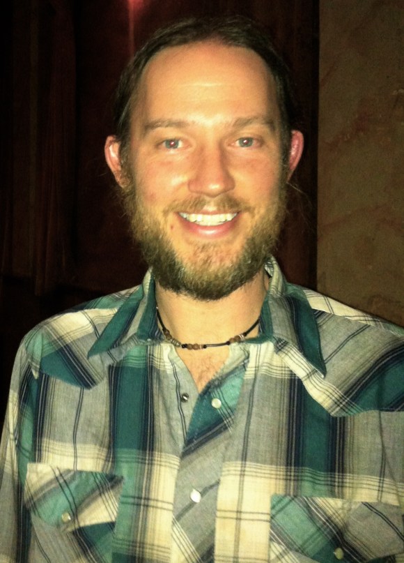 We know all of our Beards of Denver readers are hip to certain high-end designer labels, but no Louis Vuitton or Gucci hold a candle to the literally designer beard we have for you. Meet Rick, a graphic designer from Boulder who we were lucky enough to meet at the Bluebird Theatre when he showed off his singing prowess through a Jameson-fueled solo during the Pickwick show. Rick, who is originally from Cedar Rapids, Iowa, has lived in Boulder about three and a half years. Rick said that his family is not too keen on his beard, but being a clean-cut designer is out of the question. He said that he recently trimmed his beard and that normally, it's rather bushy and that we " don't know how bad it really is." Rick, if bad means good, I think we understand.