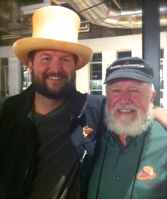 Who knew spirits and beards went so well together? The ladies of Beards of Denver, that’s who. A few months back at the D-Still spirit-tasting event in Denver (during the American Distilling Institute conference), we were lucky enough to happen upon Gary Hinegardner and his son Jeremy and their amazing father/son beards’ combo. The elder Hinegardner, who lives in Montgomery City, Missouri, with his wife, Katy, dabbles in making spirits (gin, whiskey, and vodka) and also makes the impressive wooden hats they’re modeling here. Jeremy, who has called Boulder home since 2000, runs his own company called Copious Free Time, where he helps people solve complex technology problems. Jeremy used to only have a goatee (for shame) and after attending a conference in Ireland last year (where attendees were asked to grow out their beards) he smartly decided to stay on the beard-path. Gary has had a beard or ‘stache most of his adult life (wise man indeed). Gary was a wood turner for a long time before he decided to learn how to make wooden hats, and now, spirits. His distillery is in New Florence, Missouri and he plans to let his beard continue to grow as he pursues his new passion. http://woodhatspirits.com and http://facebook.com/woodhatspirits).