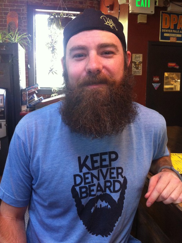 We met up with J. about a month ago at one of our favorite beard hunting grounds: Goosetown Tavern. Not only does J. rock an amazingly impressive beard, he is also a complete southern Mississippi gentleman to boot. And J. isn't an alias; he was named after his dad's best friend J.P. and has gone by J. his entire life. He originally moved to Denver a few years ago from Mississippi to attend culinary school, and now works at the multiple (and delicious) Moe's BBQ locations, where they are very welcoming of the beard culture (and Makers Mark shots, which we approve of, of course). This is the first time J. has grown his beard this long, and he said his roommate had one and that was part inspiration to grow his out. While his mom isn't his beard's biggest fan, he does believe his dad has some Beard Envy (and we can see why!) J.'s an Eagle Scout from back in the day, and if we had any say, he'd definitely earn the badge for Bad-Ass Beard! 