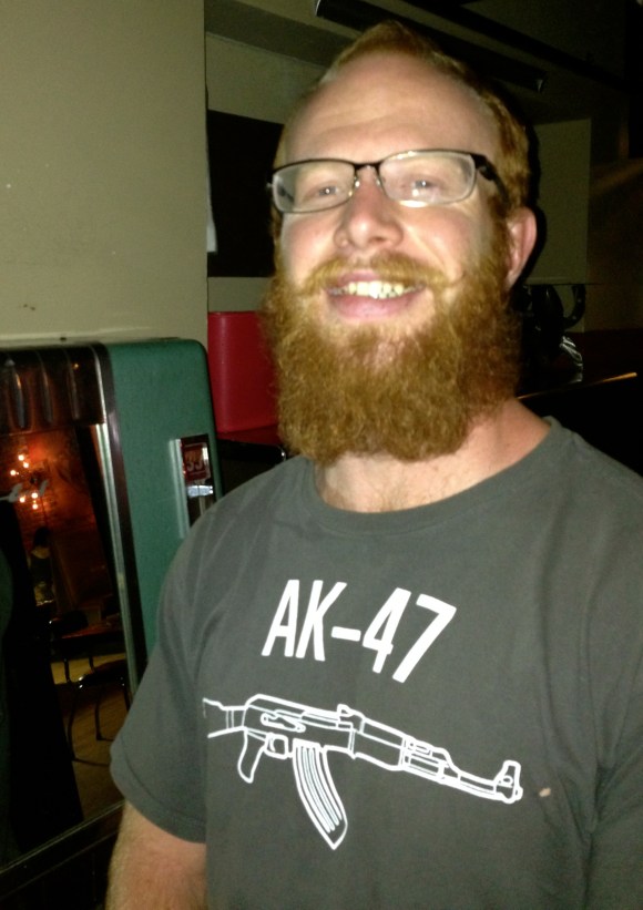 It's not every night that you're having a PBR at your neighborhood bar (in this case, The Atomic Cowboy on East Colfax) and spot an amazing red beard rockin' AK-47 t-shirt, but when you do, you know the stars have aligned. Such was the case when we met Owen recently. From Santa Fe, Owen was visiting friends in Denver with his girlfriend GiGi. GiGi loves Owen's beard, and we can certainly see why. When he's not taming that masterful beard Owen works in carpentry and framing, and of course, picking food out of his beard also keeps him occupied. Owen's had this iteration of his glorious red beard since December and plans to keep it for at least a full year. But, really, why stop there Owen? We'd vote for FOREVER.